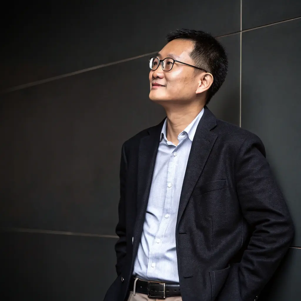 A professional headshot of Zhang Ming, the Business Manager of Wangcai28, smiling confidently.